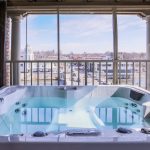 Hot tub on private screened patio of Spa Suite in our St. Charles, IL hotel and event venue