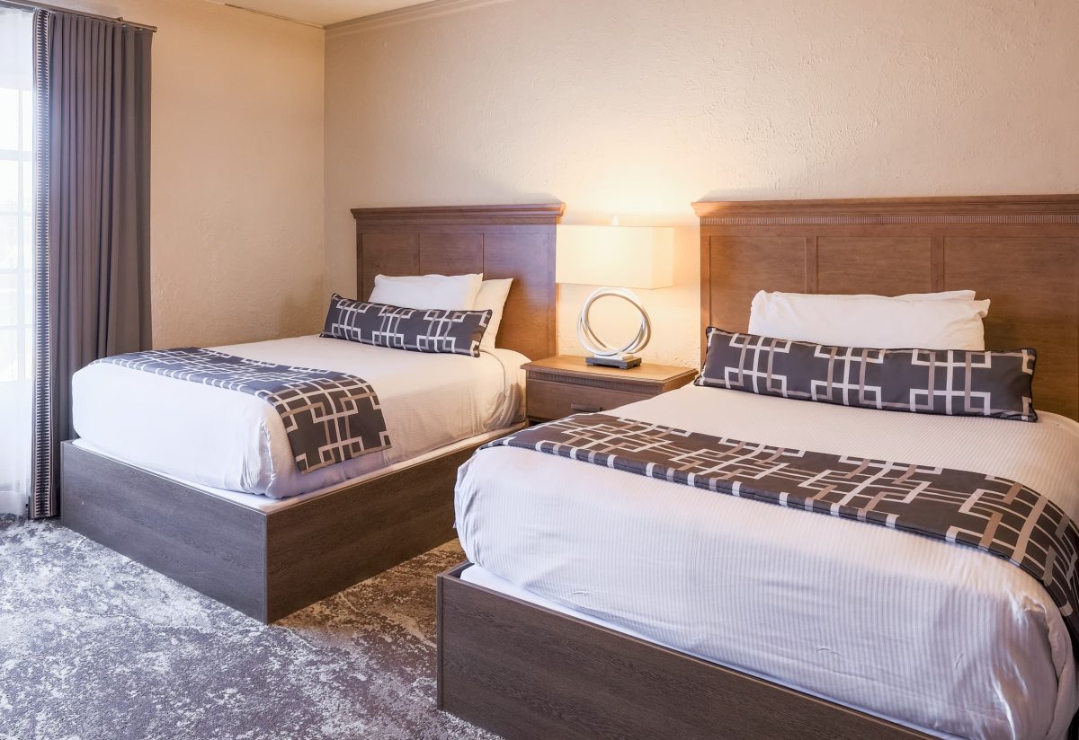 Double room with two beds and tub/shower combo in our St. Charles, IL hotel and event venue