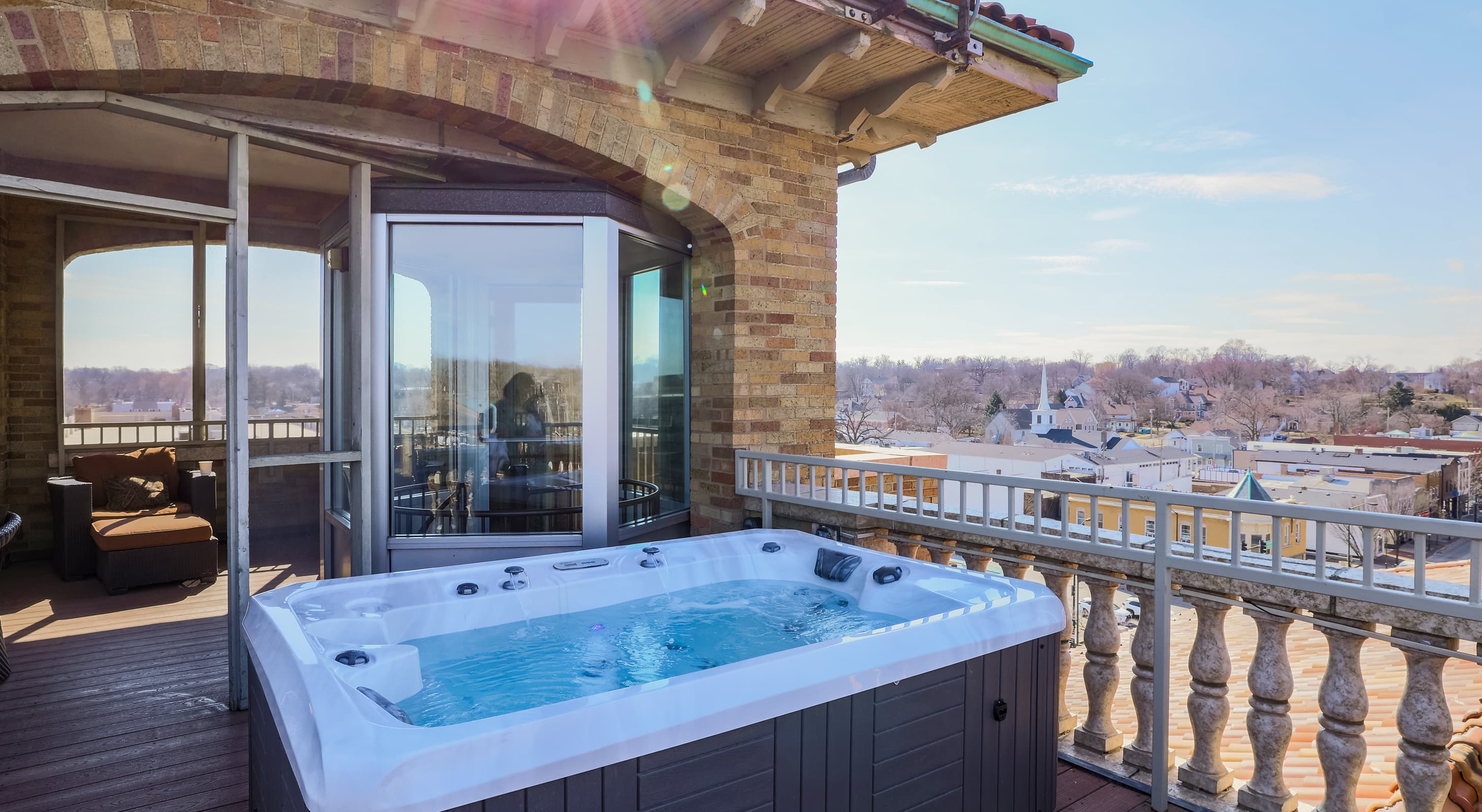 Hot tub on rooftop patio of Penthouse Suite in our St. Charles, IL hotel and event venue