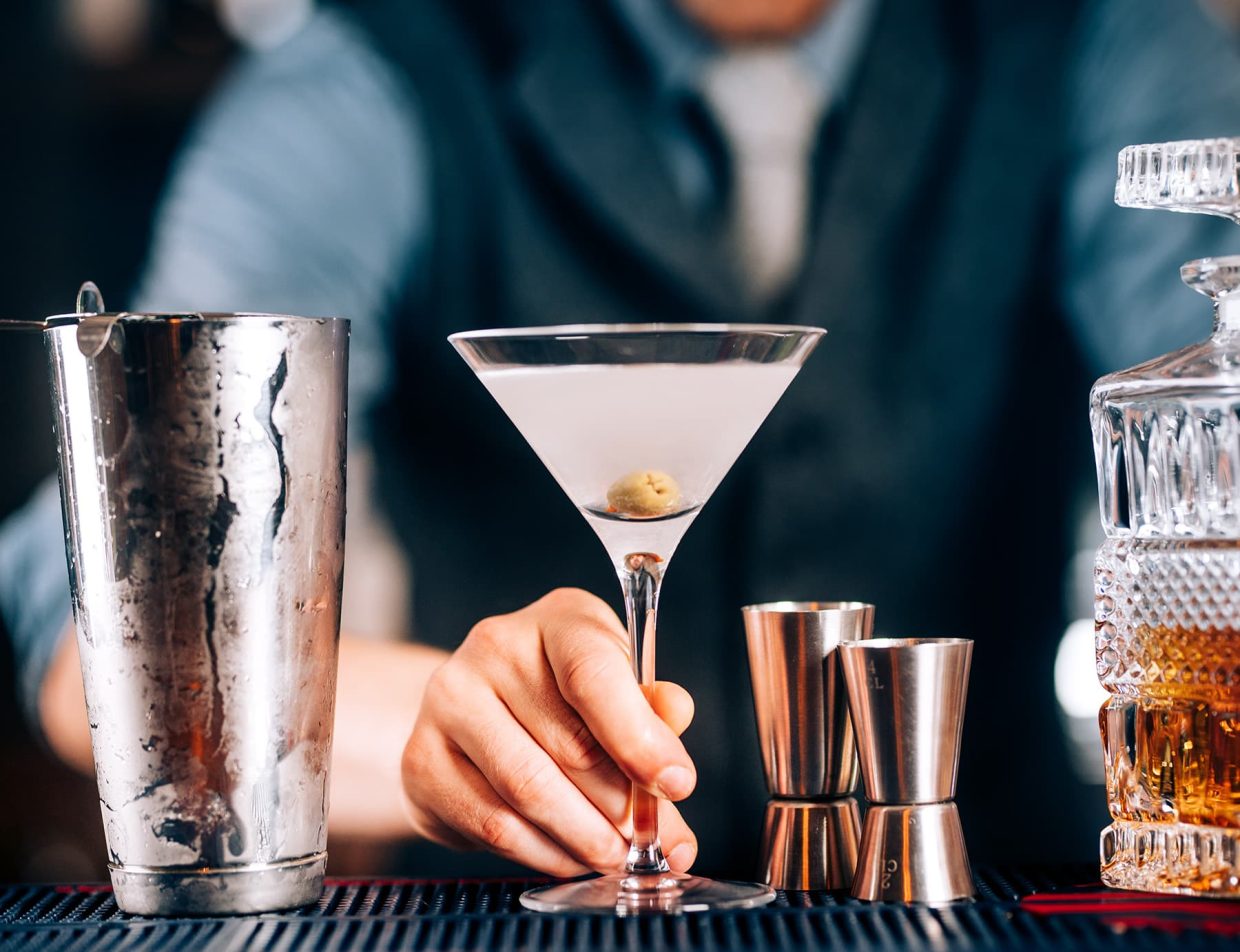 Bartender serving a martini